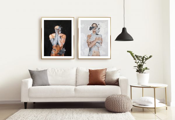 two Raúl Lara neophotorealism figurative art prints of "Nocte Latent" and "Spiritum Novum" framed in Interior of modern room with comfortable sofa