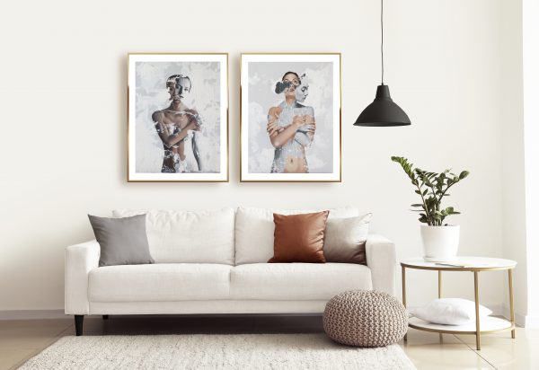 two Raúl Lara neophotorealism figurative signed edition art prints of "Contritum" and "Spiritum Novum" framed in Interior of modern room with comfortable sofa