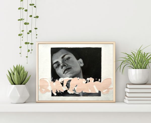 "Black and white serie 2" modern portrait with pink textured line with gold metal frame standing on the table with plants in pots and pile of books on empty white wall background