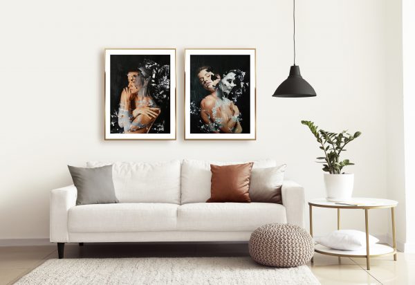 two Raúl Lara neophotorealism figurative signed edition art prints of "Gelidus" and "Bicephaly" framed in Interior of modern room with comfortable sofa
